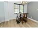 Dining room featuring a modern table set and large window offering ample natural light with stylish space at 7529 Oceanline Dr, Indianapolis, IN 46214
