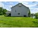View of house with well-manicured lawn and lakeside access at 7529 Oceanline Dr, Indianapolis, IN 46214