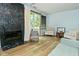 A cozy living room featuring a modern fireplace and serene natural lighting at 7529 Oceanline Dr, Indianapolis, IN 46214