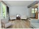 Bright living room with neutral walls, light wood floors and lots of natural light at 7529 Oceanline Dr, Indianapolis, IN 46214