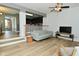 Open-concept living room showcasing modern decor, hardwood floors, and seamless flow to the kitchen at 7529 Oceanline Dr, Indianapolis, IN 46214