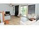 Inviting living room with fireplace, abundant natural light, neutral furnishings, and wood-look flooring at 7529 Oceanline Dr, Indianapolis, IN 46214