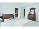 Bright main bedroom features a connected bathroom, seating, and detailed wood dresser at 7529 Oceanline Dr, Indianapolis, IN 46214
