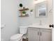 Stylish half bath with grey vanity, modern fixtures, and attractive mirror at 7742 Bayridge Dr, Indianapolis, IN 46236