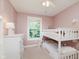 bedroom with bunk beds, dresser, and natural light at 7742 Bayridge Dr, Indianapolis, IN 46236