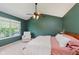 Bedroom with vaulted ceiling, large window, and a ceiling fan at 7742 Bayridge Dr, Indianapolis, IN 46236