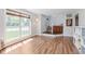 Welcoming foyer with hardwood floors, staircase, and a traditional wooden cabinet at 7742 Bayridge Dr, Indianapolis, IN 46236