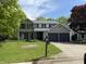 Charming two-story home featuring a two-car garage and a well-maintained front lawn at 8075 Cardinal E Cv, Indianapolis, IN 46256