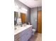 Bathroom with double sinks, updated vanity, and ample storage space at 8370 State Road 236, North Salem, IN 46165