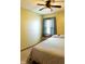 Bright bedroom featuring a large window and neutral carpet and bedding at 8370 State Road 236, North Salem, IN 46165
