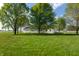 Ranch style home with large front yard and mature trees offering shade and curb appeal at 8370 State Road 236, North Salem, IN 46165