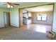 Open concept living room and dining area with carpet and many windows for natural light at 8370 State Road 236, North Salem, IN 46165