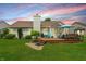 Beautiful backyard with a deck, lush green grass, and mature landscaping at 863 Lionshead Ln, Greenwood, IN 46143