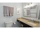 Neutral bathroom with granite vanity and framed mirror at 863 Lionshead Ln, Greenwood, IN 46143