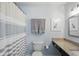 Simple bathroom with granite countertop and patterned wallpaper at 863 Lionshead Ln, Greenwood, IN 46143