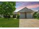 Charming home featuring brick accents, a two-car garage, and a well-manicured lawn at 863 Lionshead Ln, Greenwood, IN 46143
