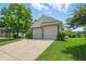 Spacious two-car garage with a concrete driveway and well-maintained landscaping at 863 Lionshead Ln, Greenwood, IN 46143