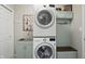 Well-organized laundry room with stacked washer and dryer at 863 Lionshead Ln, Greenwood, IN 46143