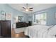 Bright main bedroom with hardwood floors, ceiling fan, and a window seat at 863 Lionshead Ln, Greenwood, IN 46143