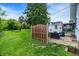 Expansive backyard with a patio, grill, fenced yard, and a fire pit area for outdoor enjoyment at 907 N Arlington Ave, Indianapolis, IN 46219
