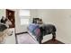 Well-lit bedroom with built in bed, natural light, and a charming decor at 907 N Arlington Ave, Indianapolis, IN 46219