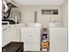 Laundry room features a washer, dryer and laundry supplies at 907 N Arlington Ave, Indianapolis, IN 46219