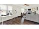 Bright living room with modern flooring, neutral walls, and a charming fireplace feature at 907 N Arlington Ave, Indianapolis, IN 46219