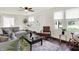 Comfortable living room with hardwood floors, stylish decor, and a cozy seating area at 907 N Arlington Ave, Indianapolis, IN 46219