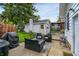 Inviting patio featuring comfortable seating, a grill, and a view of the lush backyard at 907 N Arlington Ave, Indianapolis, IN 46219