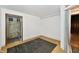 Basement area with tile floors, white walls, and storage in adjacent space at 9080 W Forest Dr, Elwood, IN 46036