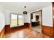 Bright dining area featuring wood floors, white walls, and a window with natural light at 9080 W Forest Dr, Elwood, IN 46036