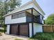 Striking modern home with balcony, two-car garage and unique architectural details at 9080 W Forest Dr, Elwood, IN 46036