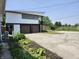 Lovely home exterior featuring modern architecture, two-car garage and spacious driveway at 9080 W Forest Dr, Elwood, IN 46036