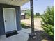 Charming home featuring a well-lit front door and landscaped entrance at 9080 W Forest Dr, Elwood, IN 46036
