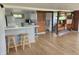Compact kitchenette featuring a breakfast bar and modern appliances at 9080 W Forest Dr, Elwood, IN 46036