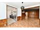 Open concept living room with updated floors, stylish lighting, and wood accents at 9080 W Forest Dr, Elwood, IN 46036