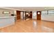 Spacious living room with hardwood floors and a unique built-in shelving unit at 9080 W Forest Dr, Elwood, IN 46036