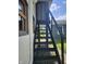 Exterior stairway providing alternate access to the home's elevated 2nd story at 9080 W Forest Dr, Elwood, IN 46036