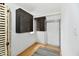 Spacious storage room with cabinets, shelving, and sleek, low pile carpet at 9080 W Forest Dr, Elwood, IN 46036