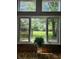 The oversized window provides picturesque views of the lush, well-maintained backyard at 9080 W Forest Dr, Elwood, IN 46036