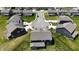 Aerial view showcases a well-planned neighborhood with manicured lawns and similar home styles at 9640 Katana Cir, Fishers, IN 46040