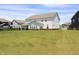 Lush backyard with green grass and surrounding homes at 9640 Katana Cir, Fishers, IN 46040