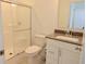 A full bathroom featuring a glass shower door and a white vanity with grey countertops and modern fixtures at 9640 Katana Cir, Fishers, IN 46040