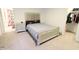 Bedroom featuring a bed and nightstand, with doorways to the bathroom and walk-in closet at 9640 Katana Cir, Fishers, IN 46040