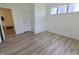 A clean and simple bedroom has laminate floors, a closet and an attached area with a coat rack at 9640 Katana Cir, Fishers, IN 46040