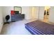 A bedroom with a bed, dresser with a mirror, and a doorway to a closet at 9640 Katana Cir, Fishers, IN 46040