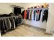 Organized walk-in closet with ample storage space and shelving for clothes and accessories at 9640 Katana Cir, Fishers, IN 46040