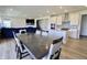 Open concept dining room and kitchen area with views to the staircase and the living room at 9640 Katana Cir, Fishers, IN 46040