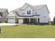 Attractive home with a three-car garage and freshly cut lawn on a sunny day at 9640 Katana Cir, Fishers, IN 46040
