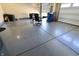 Spacious garage featuring epoxy flooring, storage, and desk area at 9640 Katana Cir, Fishers, IN 46040